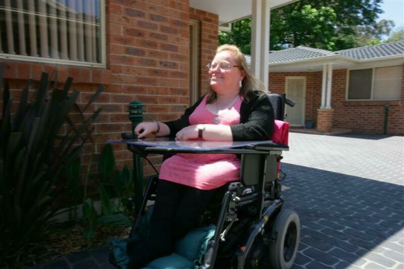 Carolyn outside her villa home she purchased in 2007.